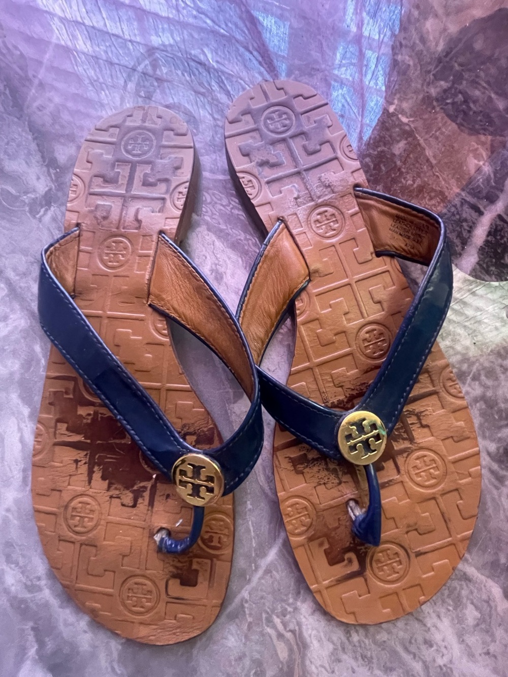 Very worn rare navy blue Tory Burch leather thora flip flops size 9